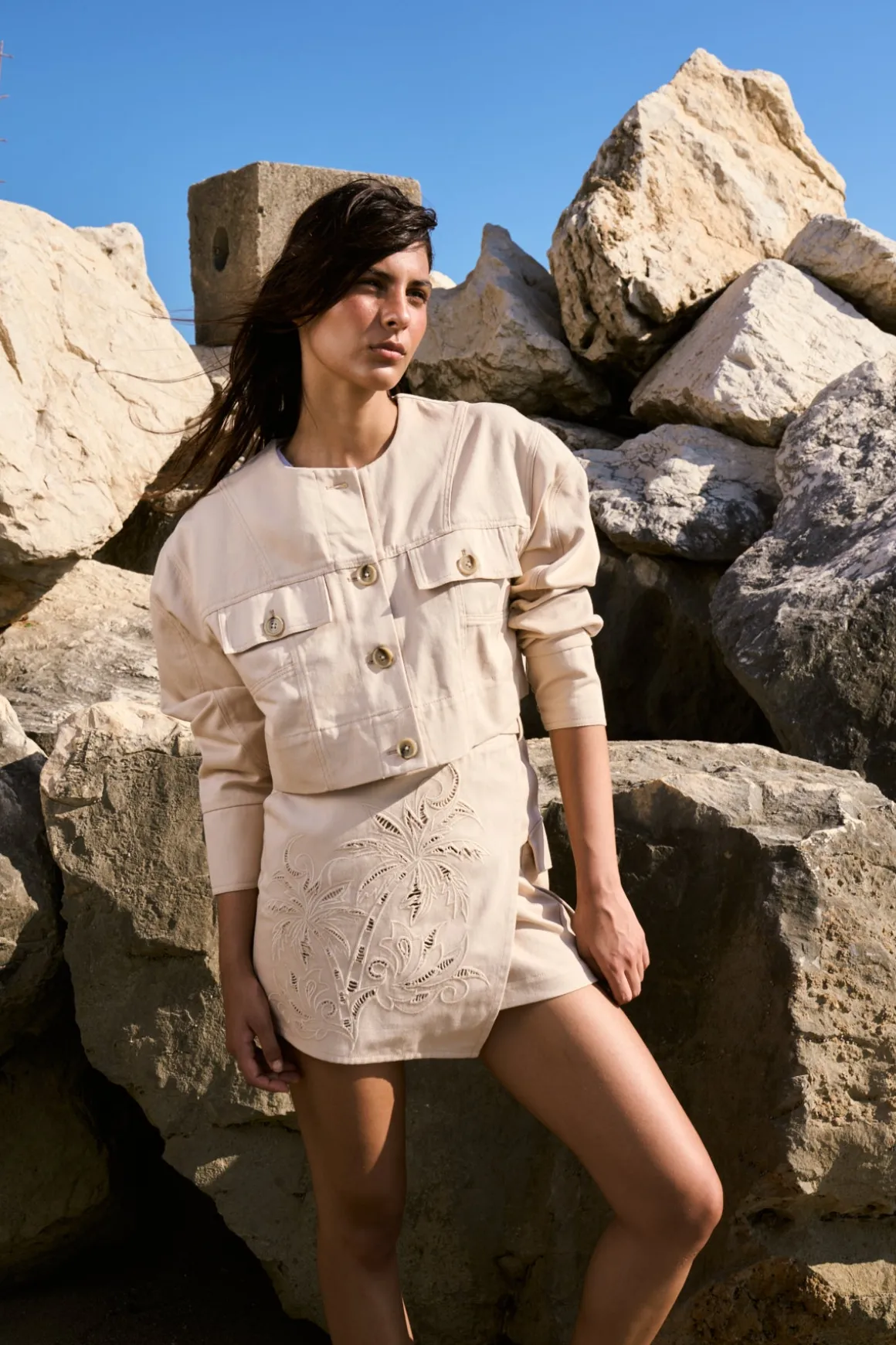 Cotton miniskirt with pierced embroidery and cargo pockets