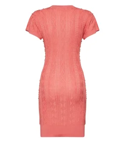 Dress with decorated surface and essential lines
