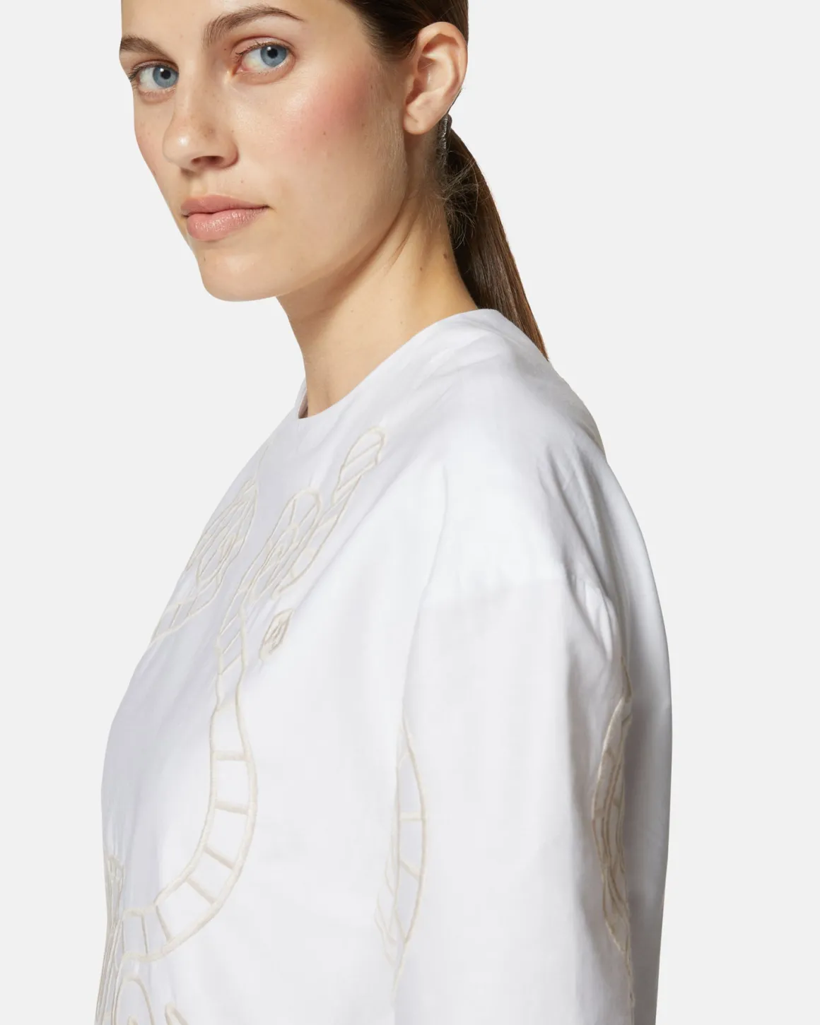 Short dress with contrasting decorative embroidery