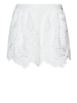 Shorts with decorative workmanship and shaped hem