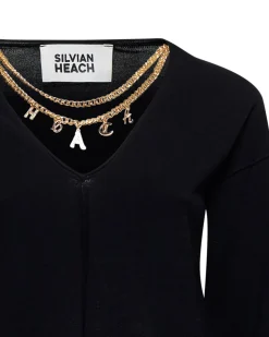 Sweater with decorative chain