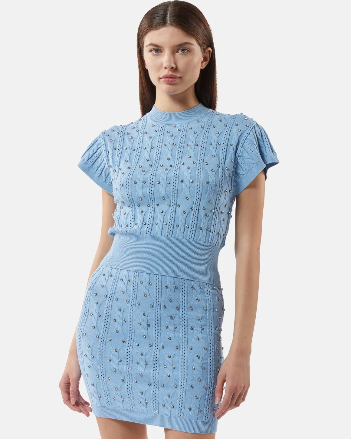 Top in shirt with studs and intertwined processing