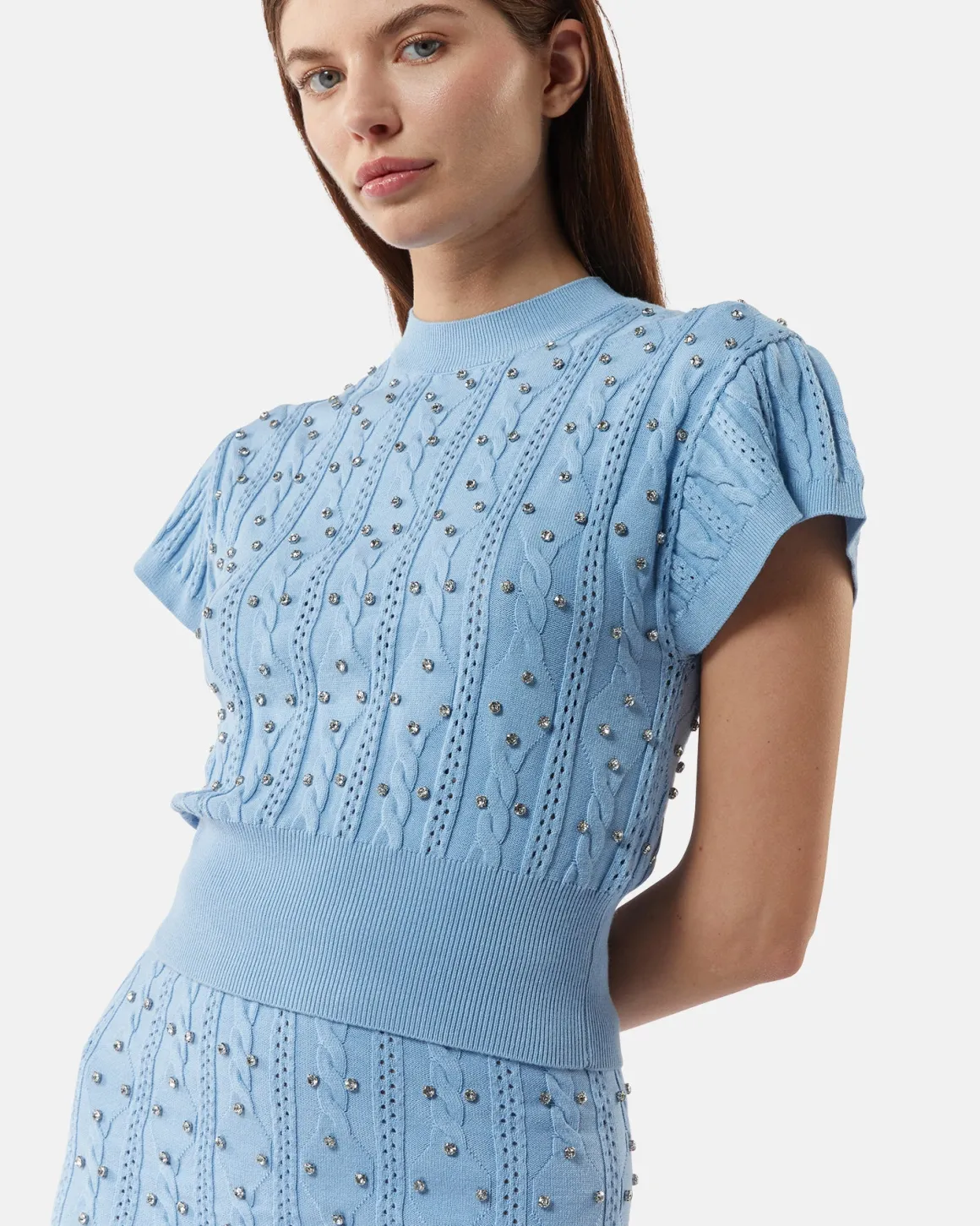 Top in shirt with studs and intertwined processing