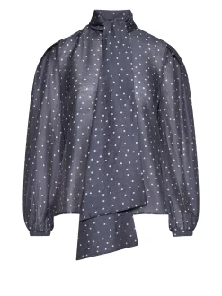 Top with micro-polka dot pattern and architectural design