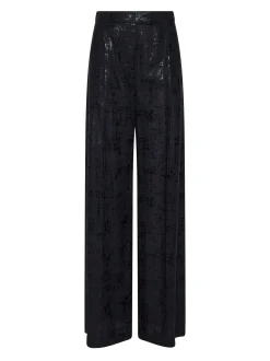Trousers with a bright finish and fluid line